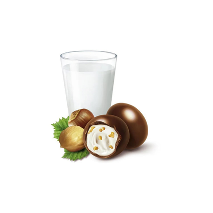 Vollmilchschokolade-Schoko-Bons mit Haselnussfüllung und Glas Milch