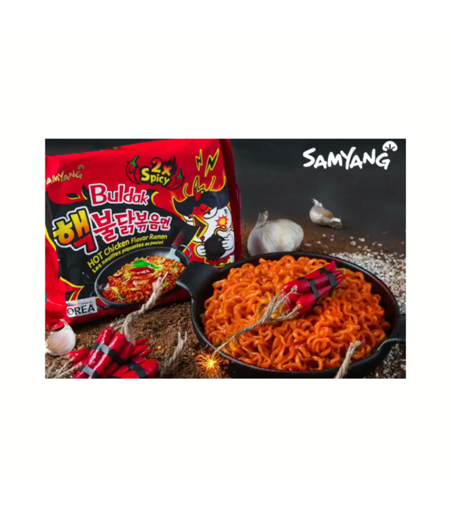 Samyang Buldak Hot Chicken Ramen 2x Spicy with orange noodles in black bowl